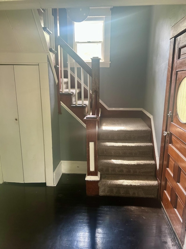 604 7th Ave E, Alexandria, MN 56308 - staircase with baseboards and wood-type flooring