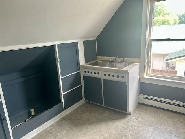 604 7th Ave E, Alexandria, MN 56308 - additional living space with lofted ceiling, baseboard heating, and healthy amount of natural light