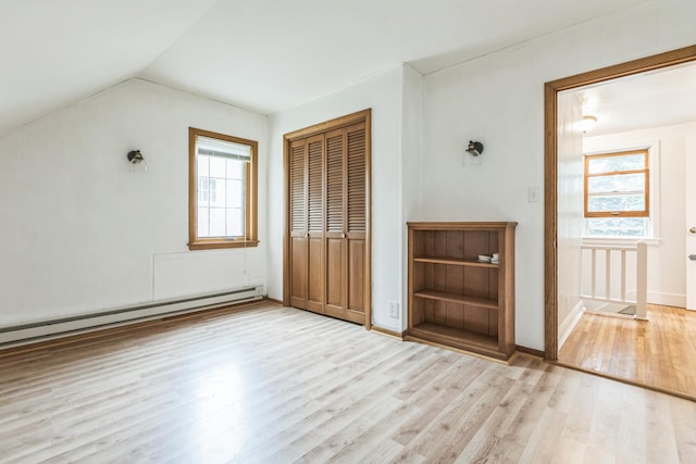5223 15th Ave S, Minneapolis, MN 55417 - additional living space with a baseboard heating unit, wood finished floors, healthy amount of natural light, and lofted ceiling
