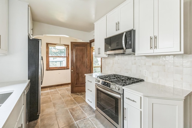 5223 15th Ave S, Minneapolis, MN 55417 - kitchen with stainless steel appliances, backsplash, white cabinets, and light countertops