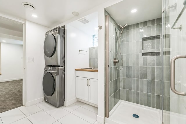 5223 15th Ave S, Minneapolis, MN 55417 - full bath with stacked washer / drying machine, a stall shower, tile patterned flooring, vanity, and recessed lighting