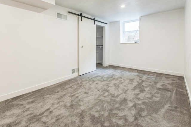 5223 15th Ave S, Minneapolis, MN 55417 - unfurnished bedroom featuring a barn door, carpet floors, a closet, and recessed lighting