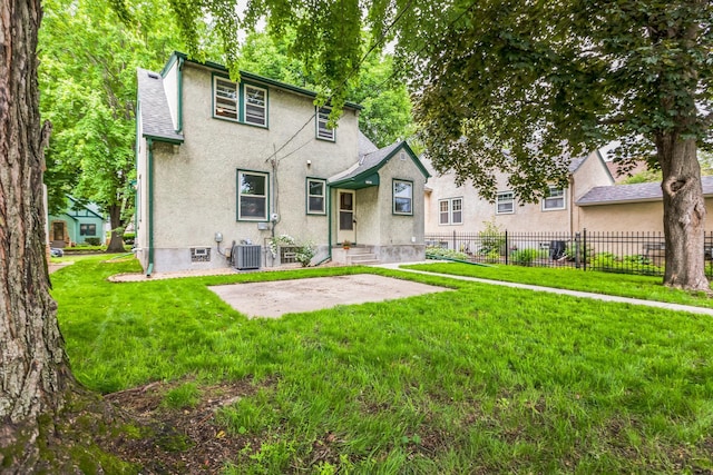 5223 15th Ave S, Minneapolis, MN 55417 - back of house with stucco siding and a patio
