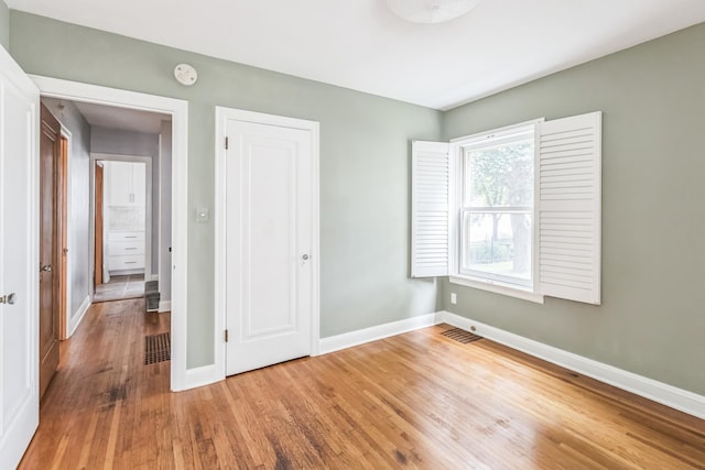5223 15th Ave S, Minneapolis, MN 55417 - unfurnished bedroom with wood finished floors and a closet