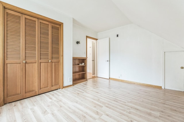 5223 15th Ave S, Minneapolis, MN 55417 - unfurnished bedroom featuring light wood-style floors, lofted ceiling, and a closet