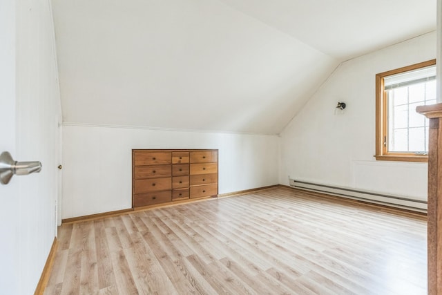 5223 15th Ave S, Minneapolis, MN 55417 - additional living space with a baseboard heating unit, lofted ceiling, and light wood-style floors