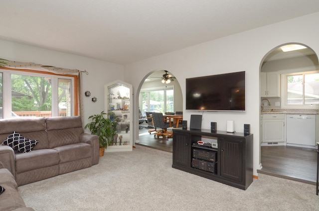 6441 Arthur St NE, Fridley, MN 55432 - carpeted living room with arched walkways and ceiling fan