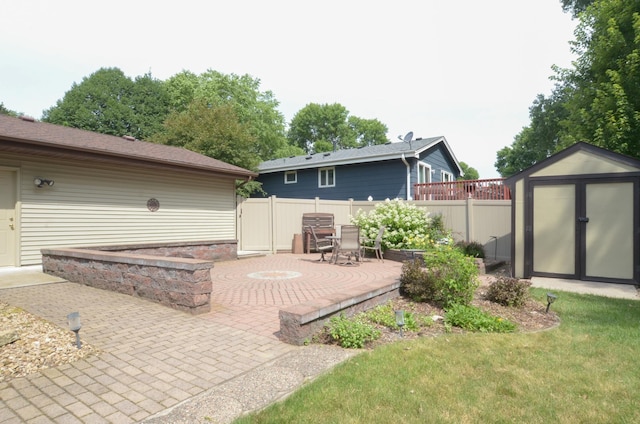 6441 Arthur St NE, Fridley, MN 55432 - view of patio featuring a shed