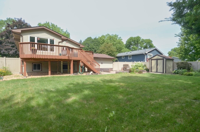 6441 Arthur St NE, Fridley, MN 55432 - rear view of property with a storage shed, stairway, a wooden deck, and a fenced backyard