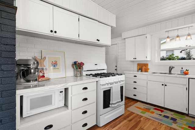 611 11th Ave, Grand Rapids, MN 55744 - kitchen featuring white appliances, light wood-style flooring, white cabinets, wood ceiling, and light stone counters