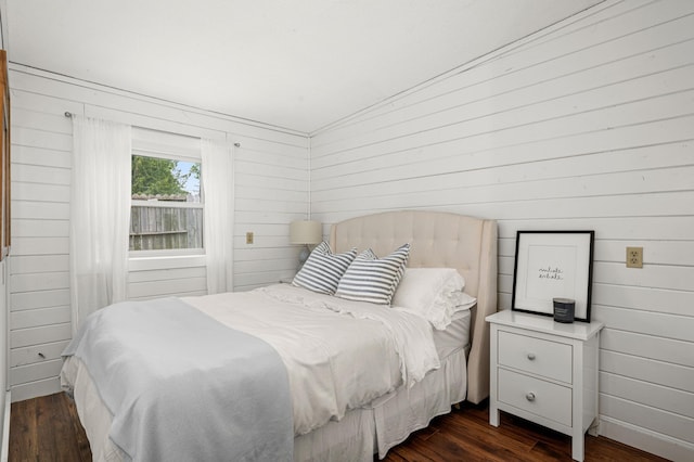 611 11th Ave, Grand Rapids, MN 55744 - bedroom with dark wood-style floors and wood walls