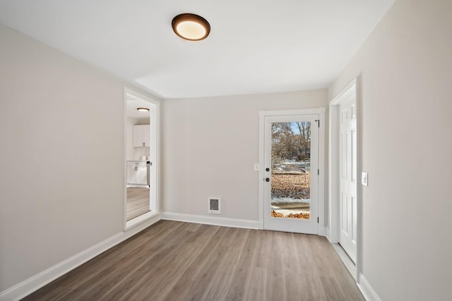 401 Plymouth Rd, Minnetonka, MN 55305 - empty room featuring wood finished floors and baseboards