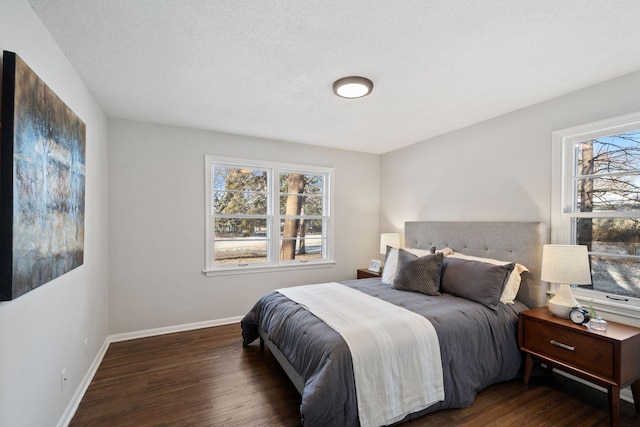 401 Plymouth Rd, Minnetonka, MN 55305 - bedroom with wood finished floors and a textured ceiling
