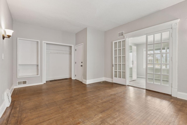 3208 Pleasant Ave, Minneapolis, MN 55408 - spare room featuring wood finished floors and french doors
