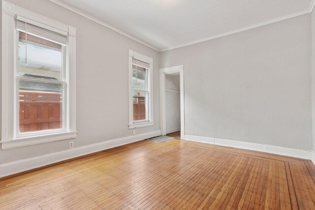 3208 Pleasant Ave, Minneapolis, MN 55408 - unfurnished room featuring ornamental molding and hardwood / wood-style flooring
