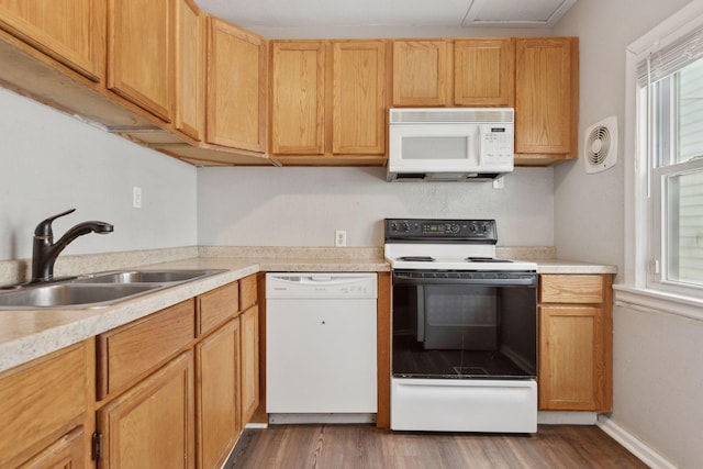 3208 Pleasant Ave, Minneapolis, MN 55408 - kitchen featuring white appliances, light countertops, and healthy amount of natural light
