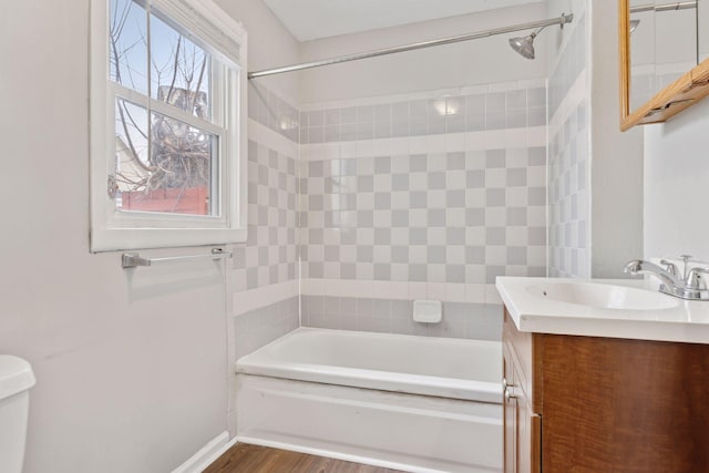 3208 Pleasant Ave, Minneapolis, MN 55408 - full bathroom with vanity, shower / bathtub combination, and wood finished floors