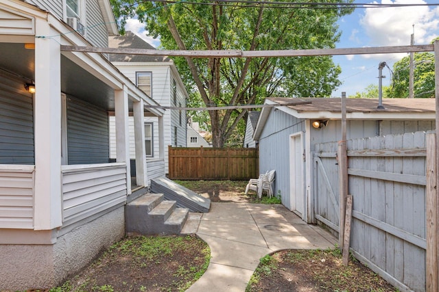3208 Pleasant Ave, Minneapolis, MN 55408 - view of patio featuring entry steps and a storage shed