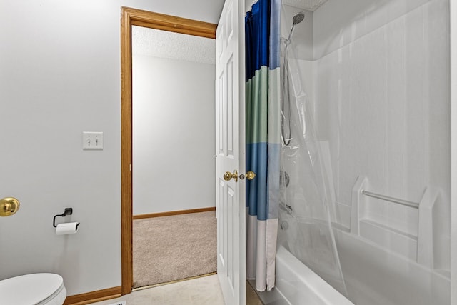 1587 Liberty St, Shakopee, MN 55379 - bathroom featuring shower / bath combo and a textured ceiling