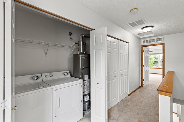 1587 Liberty St, Shakopee, MN 55379 - laundry room with water heater, independent washer and dryer, light carpet, and a textured ceiling
