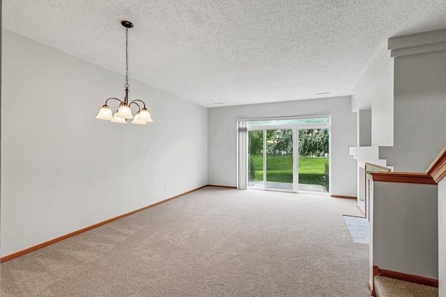 1587 Liberty St, Shakopee, MN 55379 - spare room featuring a chandelier, carpet flooring, a textured ceiling, and a fireplace
