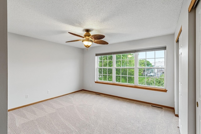 1587 Liberty St, Shakopee, MN 55379 - unfurnished room with ceiling fan, carpet flooring, and a textured ceiling