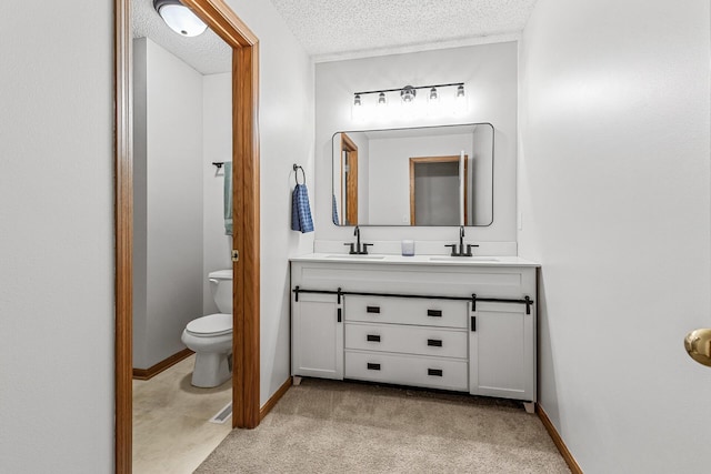 1587 Liberty St, Shakopee, MN 55379 - full bathroom featuring double vanity, a textured ceiling, and track lighting