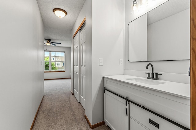 1587 Liberty St, Shakopee, MN 55379 - bathroom with a textured ceiling, vanity, and ceiling fan