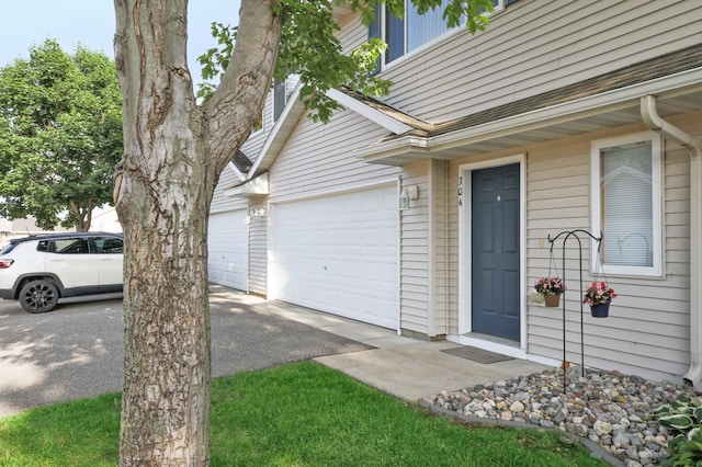 304 Tanager Path, Mankato, MN 56001 - property entrance featuring driveway and an attached garage