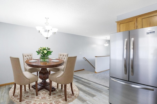 304 Tanager Path, Mankato, MN 56001 - dining space with light wood-type flooring and a chandelier