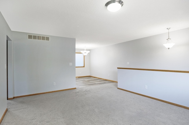 304 Tanager Path, Mankato, MN 56001 - carpeted empty room with a chandelier and baseboards