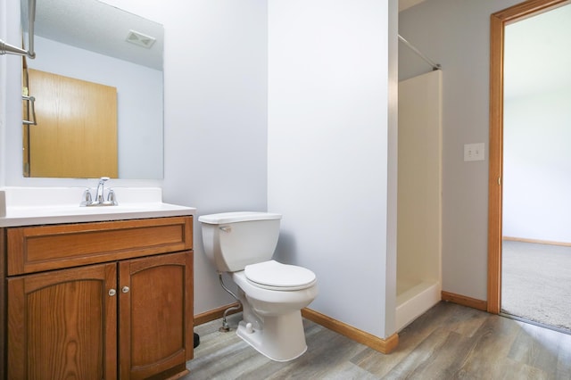 304 Tanager Path, Mankato, MN 56001 - full bathroom with wood finished floors, a shower, and vanity