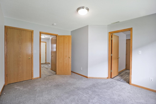 304 Tanager Path, Mankato, MN 56001 - unfurnished bedroom featuring carpet flooring and baseboards