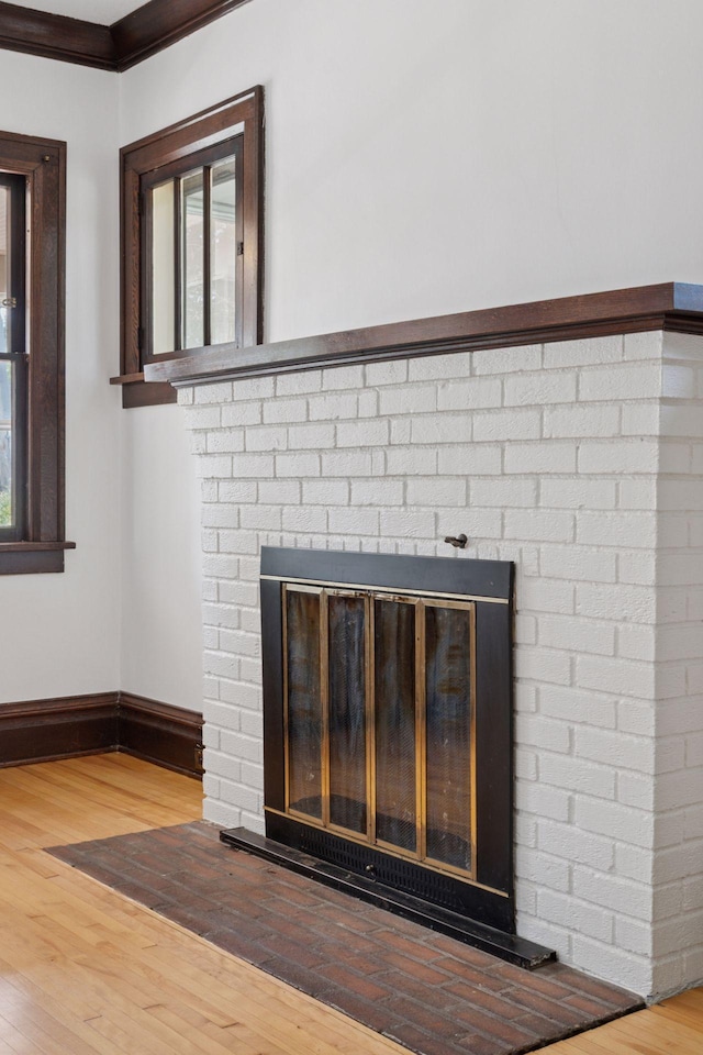 720 40th St, Minneapolis, MN 55409 - detailed view of a brick fireplace and wood finished floors