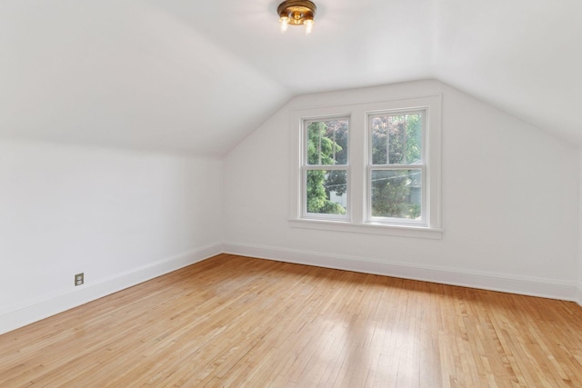 720 40th St, Minneapolis, MN 55409 - additional living space featuring vaulted ceiling and hardwood / wood-style floors