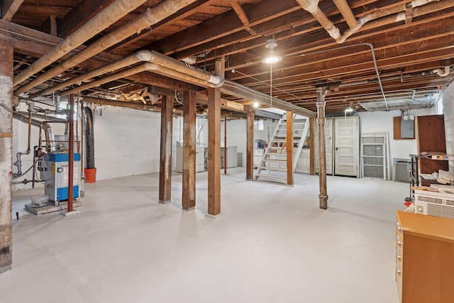 720 40th St, Minneapolis, MN 55409 - unfinished basement with stairs, a heating unit, and washer / clothes dryer