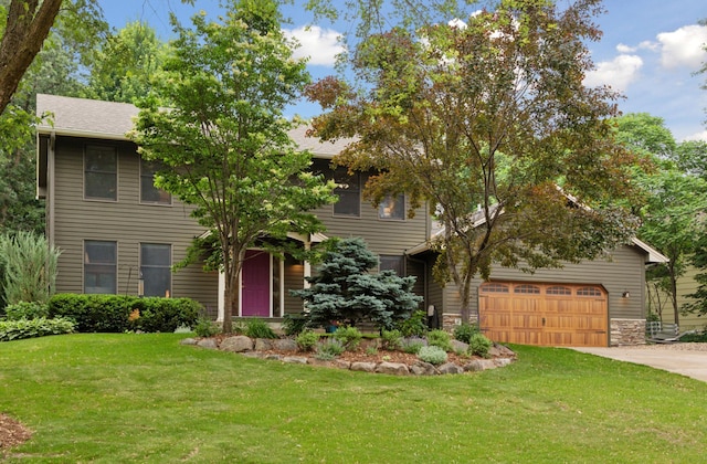 17233 Harrington Way, Lakeville, MN 55044 - view of front of home with concrete driveway, a front yard, and stone siding