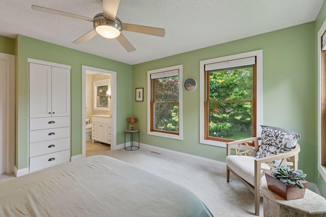 17233 Harrington Way, Lakeville, MN 55044 - bedroom with light colored carpet, a textured ceiling, ensuite bathroom, and a ceiling fan