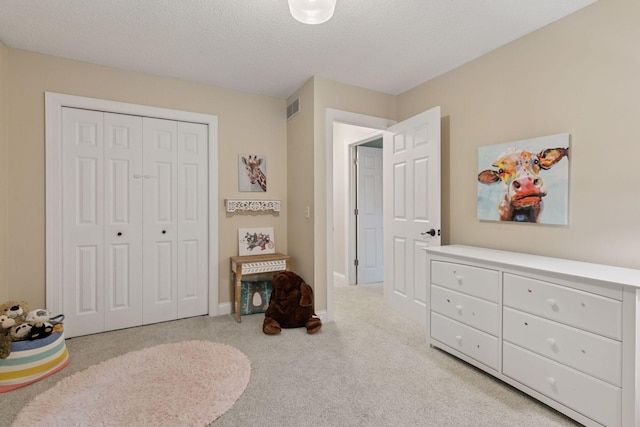 17233 Harrington Way, Lakeville, MN 55044 - bedroom with carpet, a closet, and a textured ceiling
