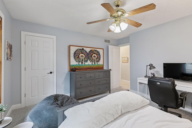 17233 Harrington Way, Lakeville, MN 55044 - carpeted bedroom with an office area, a ceiling fan, and a textured ceiling