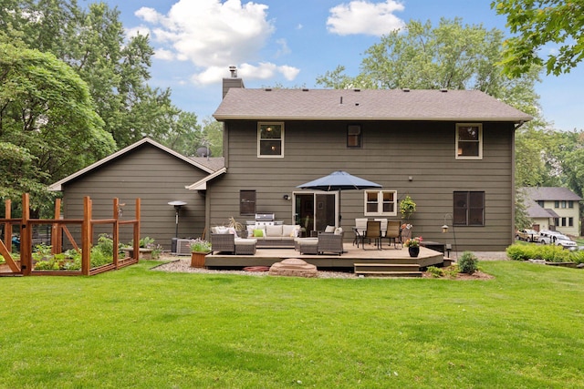 17233 Harrington Way, Lakeville, MN 55044 - back of house featuring outdoor lounge area, a chimney, a wooden deck, a garden, and a lawn