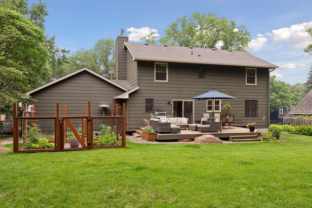 17233 Harrington Way, Lakeville, MN 55044 - back of house with an outdoor living space, a vegetable garden, a chimney, and a deck