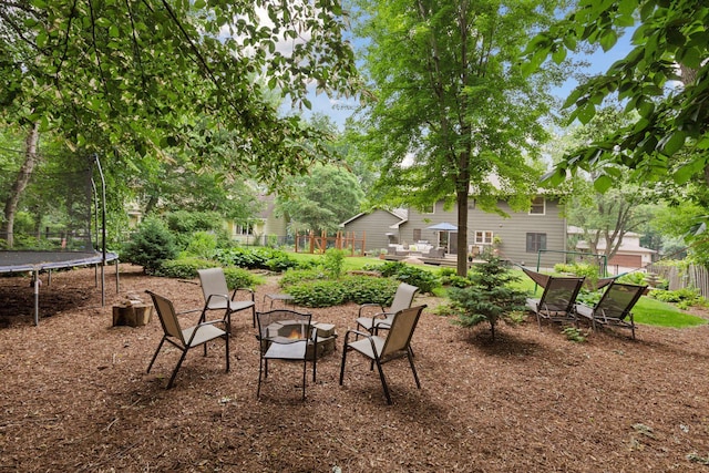 17233 Harrington Way, Lakeville, MN 55044 - view of yard with a trampoline and a fire pit