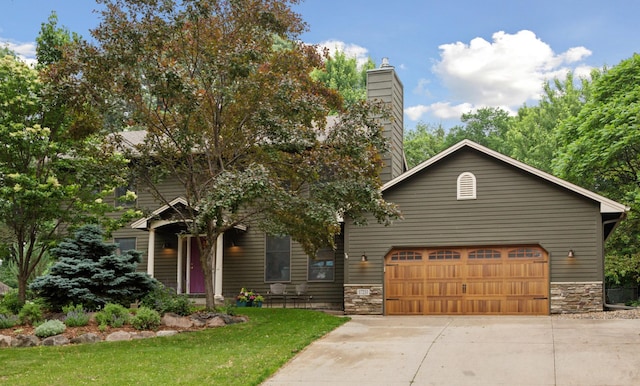 17233 Harrington Way, Lakeville, MN 55044 - view of front of house featuring driveway, stone siding, a front yard, and a garage