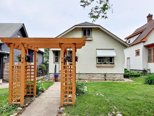 4223 12th Ave S, Minneapolis, MN 55407 - view of front of house featuring a front yard and a pergola