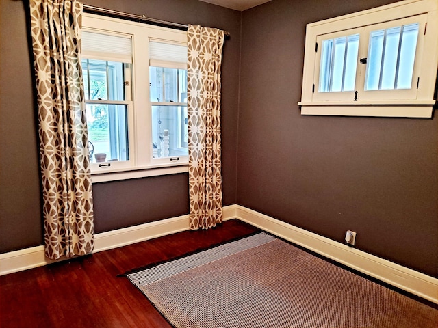 4223 12th Ave S, Minneapolis, MN 55407 - spare room featuring baseboards and wood finished floors