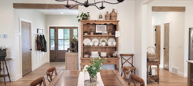9029 Crown Hill Ct, Brainerd, MN 56401 - dining area featuring light wood-type flooring and a chandelier