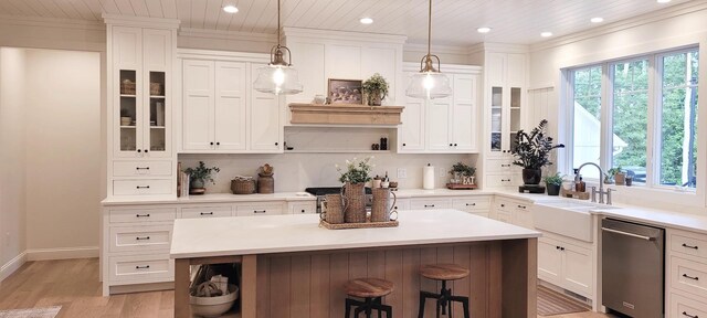 9029 Crown Hill Ct, Brainerd, MN 56401 - kitchen with open shelves, stainless steel dishwasher, recessed lighting, a kitchen bar, and white cabinets