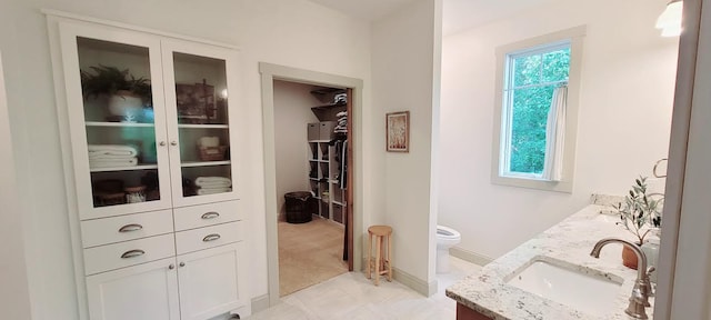 9029 Crown Hill Ct, Brainerd, MN 56401 - bathroom featuring double vanity and a walk in closet