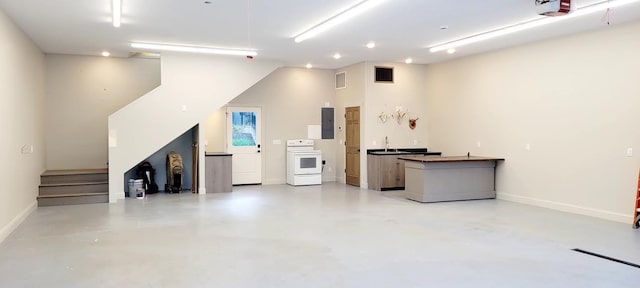 9029 Crown Hill Ct, Brainerd, MN 56401 - garage featuring electric panel, recessed lighting, and a garage door opener